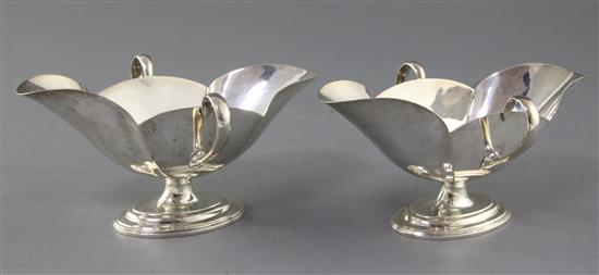 A pair of Edwardian Scottish silver double lipped two handled sauceboats by Hamilton & Inches, 12.5 oz.